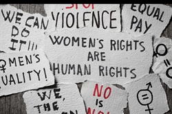 [ai] A collection of handwritten signs on textured paper, with phrases advocating for women's rights, such as "Women's Rights Are Human Rights," "Equal Pay," and "No Is No," among others.